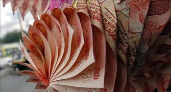 Rupee hits record low, breaches 61 per dollar mark