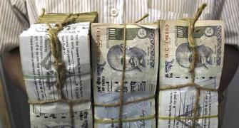 Rupee pares gains, at 59.66/dollar