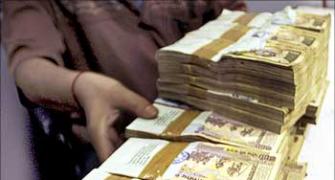 Rupee up 14 paise against dollar