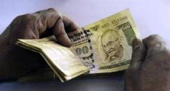 Rupee ends at over 1-month low, down 8 paise