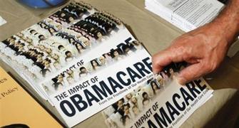 Obama says sorry to Americans losing health insurance cover