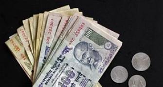 Rupee gives up early gains, ends four paise down at 61.27