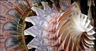 Rupee trims initial gains, still up 4 paise