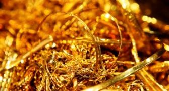 Gold extends losses on subdued demand, global cues