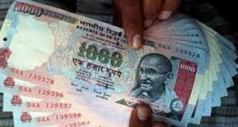 Rupee trims initial losses, still down 8 paise