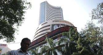Sensex edges to record high, closes at 21,935