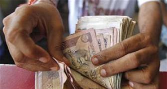 Rupee jumps 34 paise to 61.41 in late morning trade