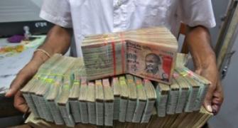 Rupee trims some initial gains; up 17 paise