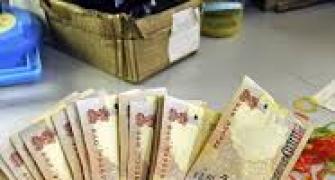 Rupee ends 13 paise lower against US dollar