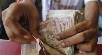 Rupee trims initial losses, still down by 8 paise