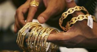 Gold dips to 3-month low; silver drops on global cues