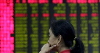 Asian shares sag as China stocks wobble after trading resumes