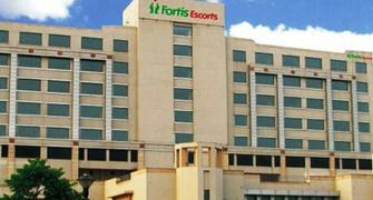 Fortis shareholders vote out director, shadow over sale