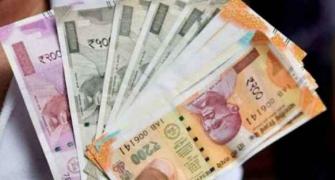 Rupee slips 12 paise to 77.74 against US dollar