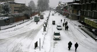 PHOTOS: Snowfall in Srinagar affects normal life