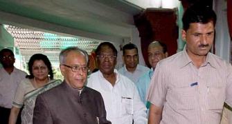 Pranab casts his vote with PM, Sonia by his side