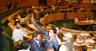 PIX: Three youth storm into the well of J&K assembly