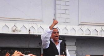 Azam Khan 'gifts' broom, pen to MLAs; taunts Modi