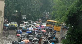 In PHOTOS: Mumbai slows down as rains hit road, rail traffic