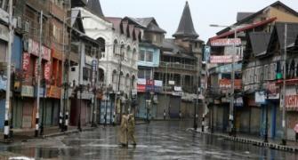 Curfew in various J-K districts; army stages flag march