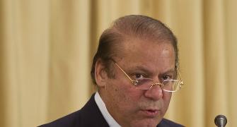 Did Sharif  refer to the PM as 'village woman'?