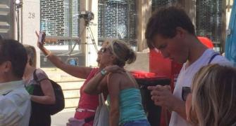 SHOCKING! Tourists pose for selfies at Sydney hostage spot