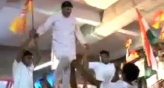 BJP leader WALKS over young boys. BOO him!