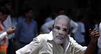 Riding on Modi wave, BJP and allies set to cross 300 seats