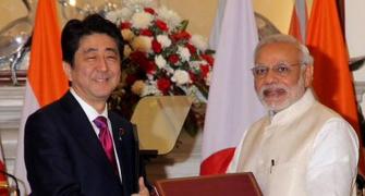 Modi, Japan's Shinzo Abe put bullet train on track, sign defence agreements