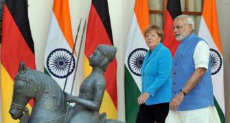'Real business of diplomacy' as PM, Germany's Merkel hold talks