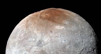 Pluto 'paints' its largest moon red: NASA