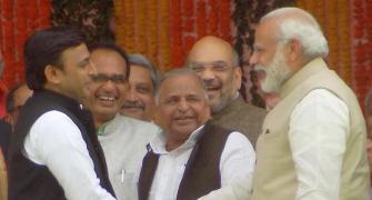 PHOTOS: After trading barbs, PM shares light moment with Akhilesh
