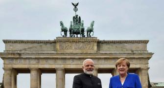 PM poses with Merkel at Brandenburg Gate before leaving Berlin