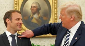 Hair you go: Trump brushes dandruff off 'perfect' Macron