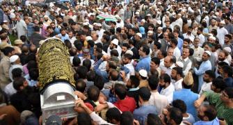 Thousands gather for last rites