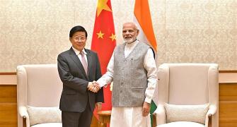 What was Xi Jinping's confidant doing in India?