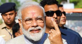PM Modi votes, says 'voter ID' more powerful than IED