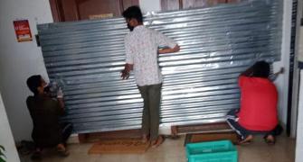 Officials seal houses with metal sheets in Bengaluru