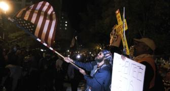 As US counts votes, protesters take to the streets