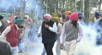 Facing water canons, tear-gas, farmers push to Delhi