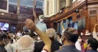 Opposition MPs climb on table, throw papers in RS