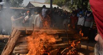 Kashmir: Slain principal cremated amid protests