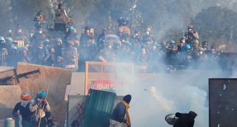 Haryana police fire tear gas as farmers head to Delhi