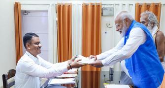 Allies by his side, Modi files nomination; no Nitish