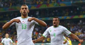 Draw sends Algeria through, Russia home