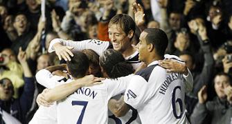 Crouch hat-trick gives Tottenham Champions League berth