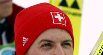 Swiss Ammann soars to first gold