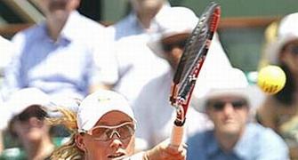 Bartoli ousted at Stanford, Stosur battles on