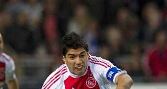 Ajax ban Suarez for biting PSV player