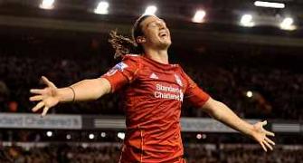 Carroll double helps Liverpool crush Man City